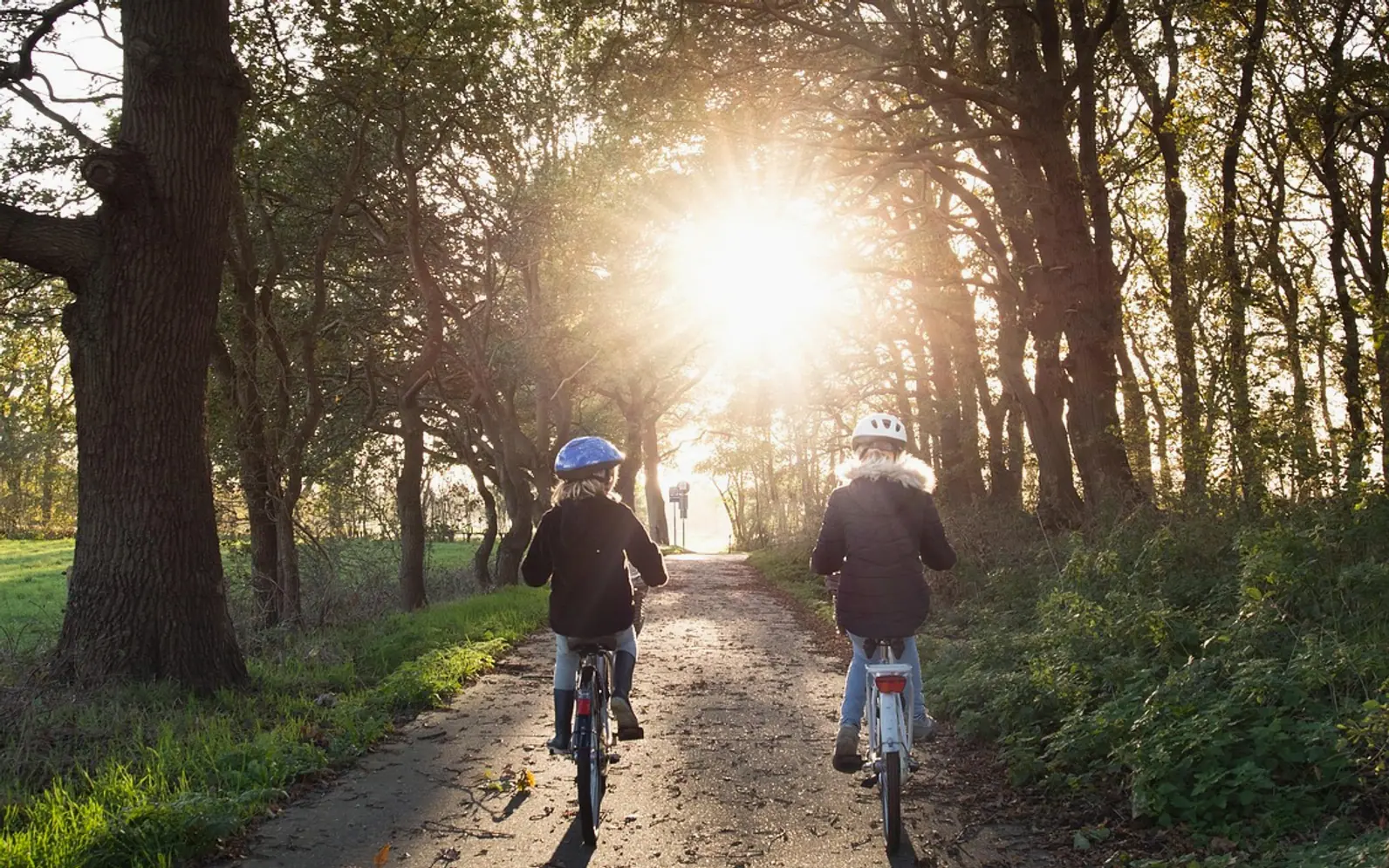 Girls, bicycle and helmets