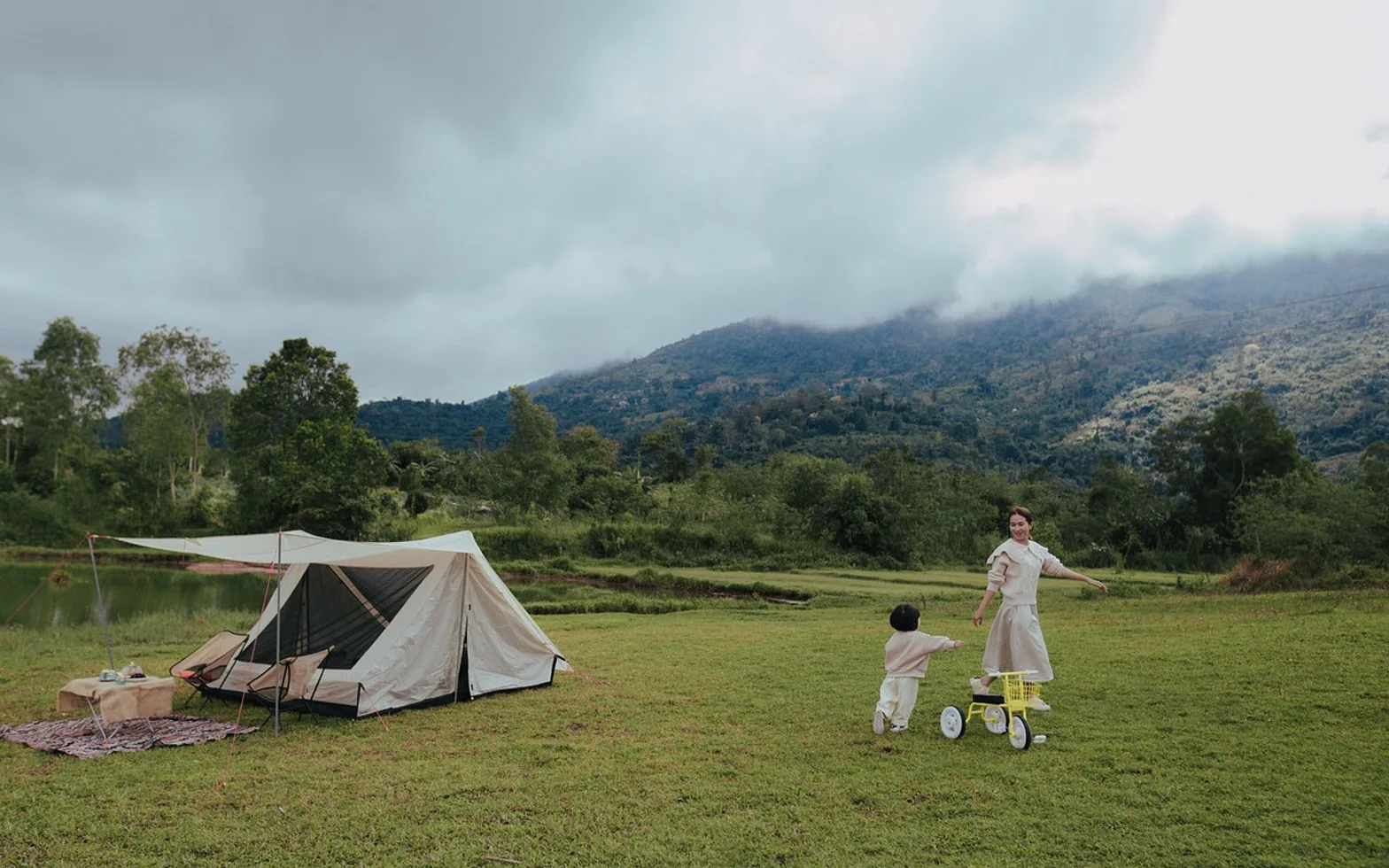 Camping, mother and child and lakeside